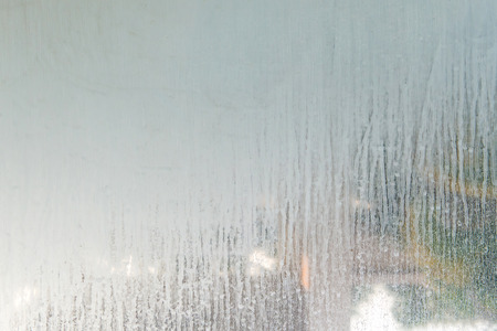 close up dry water stains on the glass wall in bathroom.
