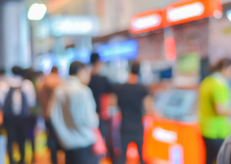 Abstract of blurred people walking in shopping centre.の写真素材
