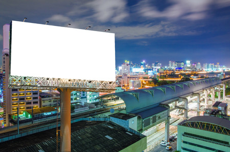 Blank billboard for advertisement in city downtown at night.の写真素材