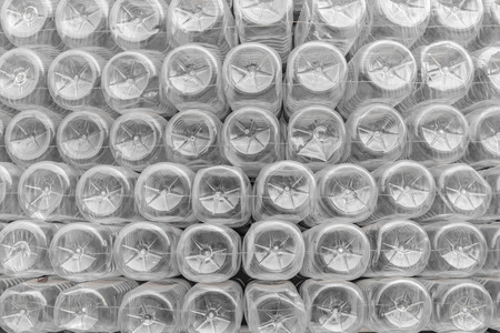 Stack of bottom plastic bottles texture for background.の写真素材
