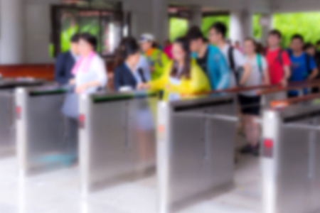 blur people at queue in front of exhibition gate, abstract blurred background.の写真素材