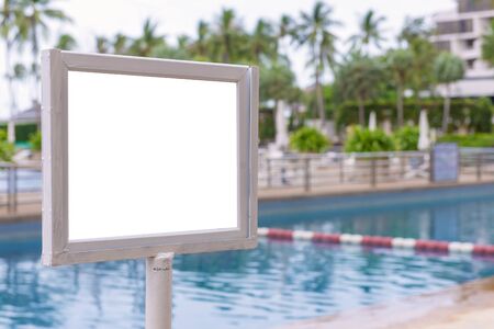empty of sign standing near a swimming pool.の写真素材