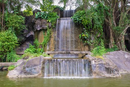 Waterfall in garden at the public park.の写真素材