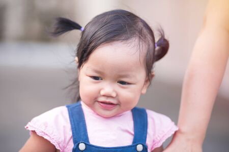 Portrait of little baby girl, childhood and people concept.の写真素材