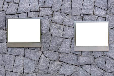 blank of aluminum photo frame or empty poster billboard on stone brick wall for concept design.
