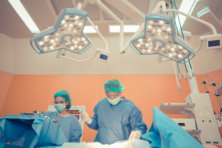 Medical physician doctor or Surgery team in operation room with lighting at hospital.の写真素材