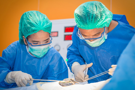 Medical physician doctor or Surgery team in operation room with lighting at hospital.の写真素材