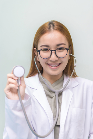 Portrait of Medical physician doctor woman standing in hospital.の写真素材