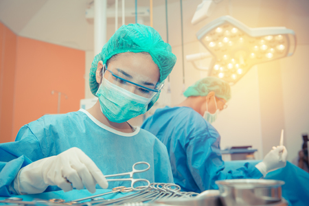 Medical physician doctor or Surgery team in operation room with lighting at hospital.の写真素材