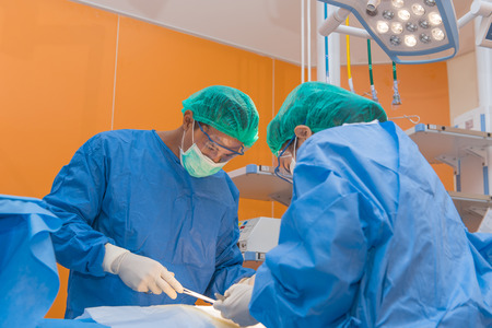 Medical physician doctor or Surgery team in operation room with lighting at hospital.