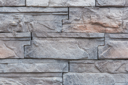 Background of Modern Slate stone Brick Wall Surfaced for design.