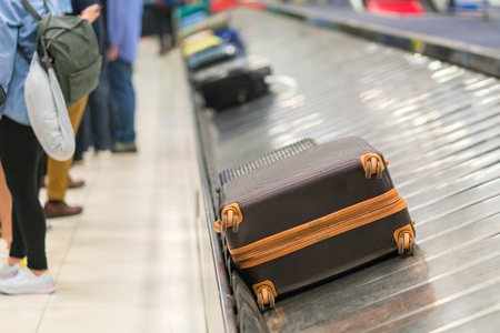 Suitcase or luggage with conveyor belt in the airport.の写真素材