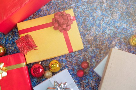 Luxury New Year gift box and Christmas gift boxed with bow ribbon in Christmas background.