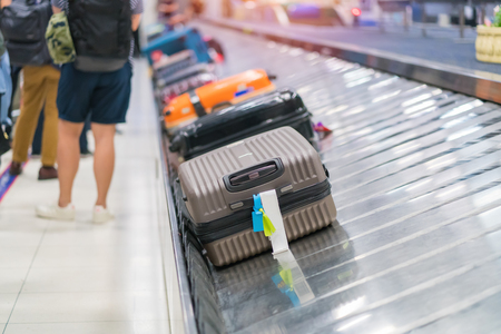 Suitcase or luggage with conveyor belt in the airport.の写真素材