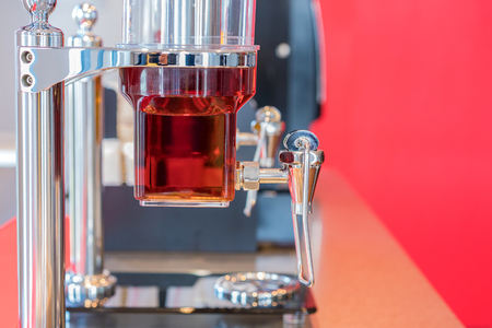 Fruit juice in water cooler for breakfast at the hotel.の写真素材