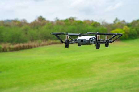 Flying  above the green grass golf court.