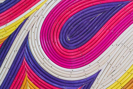 Colorful painted bamboo or rattan for background.の写真素材