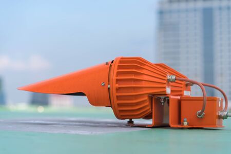 Red Lights on top of tower building for warning air plane.の写真素材