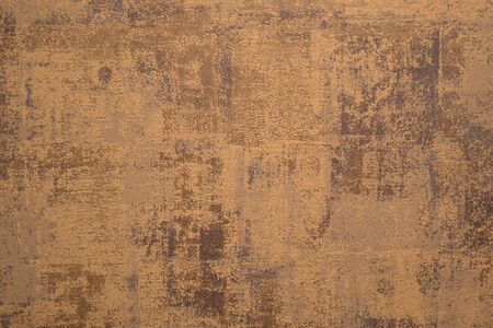 Cement background with a texture of gold wall.