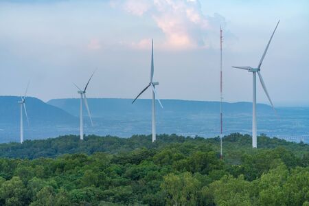 Wind turbine renewable energy source summer in forest mountains landscape energy transmission...