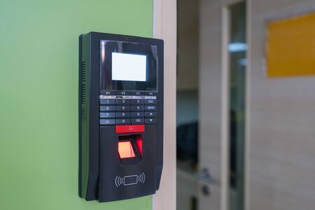fingerprint scanner on wall to record working time or enter security system.の写真素材