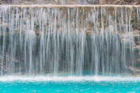 landscape of beautiful Artificial waterfall in garden at the public park.の写真素材