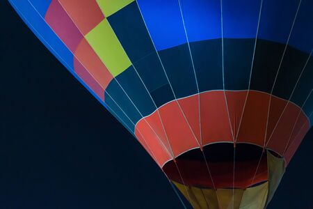 colorful Hot air balloon ready for take off in sky in night. Freedom concept.の写真素材