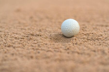 Golfer hit Golf ball on sand trap bunker at golf courses.の写真素材