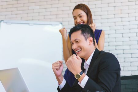 business man and secretary working together using laptop computer at modern office, Lifestyle business work at home concept.の写真素材