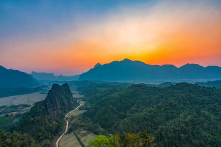 Top view of Beautiful Forest landscape of Sunset at pha Namxay Mountains Vang Vieng, Laosの写真素材