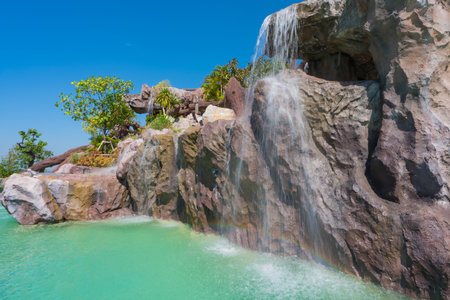 landscape of beautiful Artificial waterfall in garden at the public parkの写真素材
