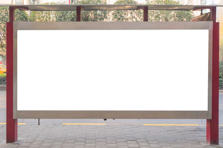 Mockup image of Blank billboard white screen posters billboard at bus station on road with city view background for advertising.の写真素材