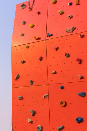 outdoor sports climbing stone wall with multiple grips simulating mountain climbing, extreme hobby concept.の写真素材