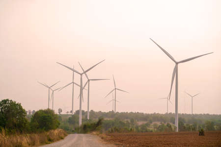 Wind turbine renewable energy source summer with sky.