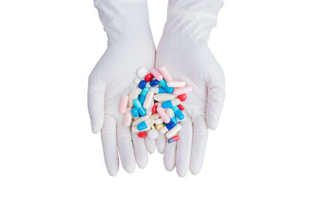 Doctor woman holding pill or medication in capsule. concept of pharmacist, drugs, diet pill,...