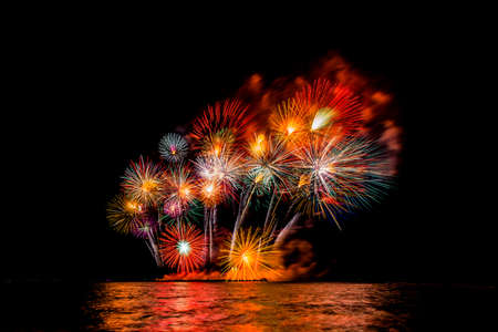Colorful fireworks of various colors at night with celebration and anniversary concept.