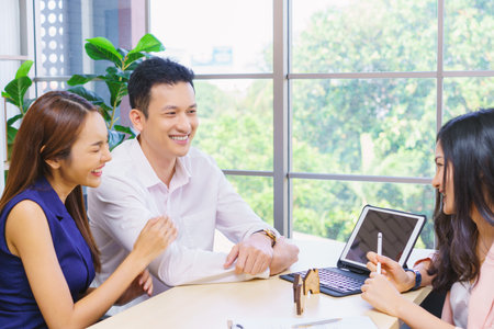 businessman and secretary with team business working together using laptop computer at modern office, Lifestyle business work at home concept.の写真素材