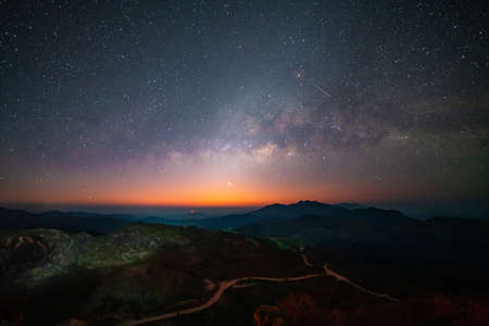 Panorama view universe space shot of milky way galaxy with stars on night sky background at mountains landscape Thailand.の写真素材