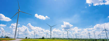 Banner Wind turbine renewable energy source summer with blue sky.
