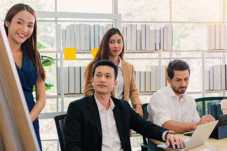 businessman and secretary with team business working together using laptop computer at modern office, Lifestyle business work at home concept.の写真素材