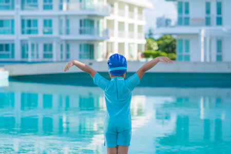 Cute girl with goggles having fun in summer in the pool summer vacation concept.の写真素材