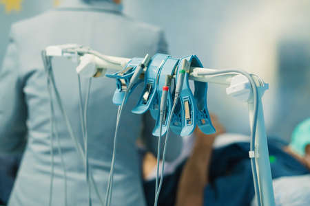 ECG or EKG of man with electrodes for electrocardiogram records on bed in hospital.