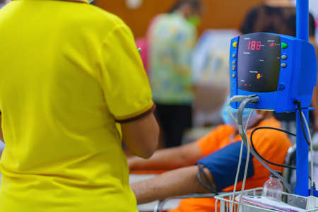 Doctor checking patient arterial blood pressure in hospital. Health care Concept.の写真素材