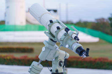 Modern telescope for landscape exploring the night sky.