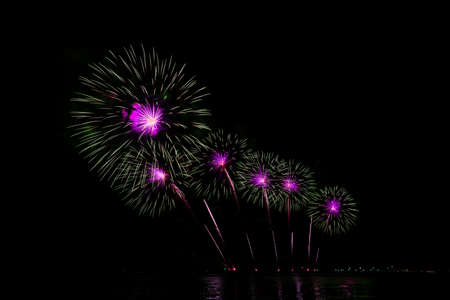 Colorful fireworks of various colors at night with celebration and anniversary conceptの写真素材