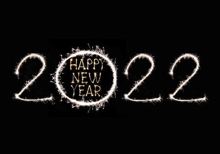 Happy New Year 2022 text hand written sparkles fireworks.