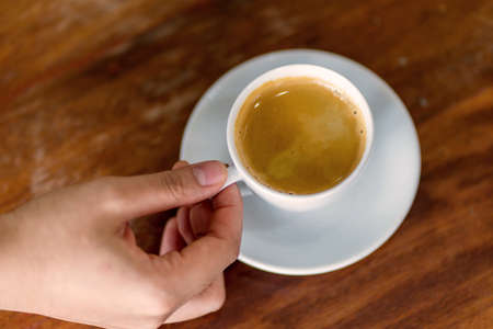 woman drinking espresso at coffee cafe.の写真素材