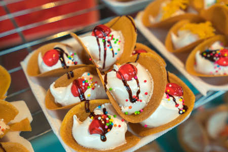 Thai Crispy Pancake, Dessert filled with cream on the street food in Thailand.の写真素材