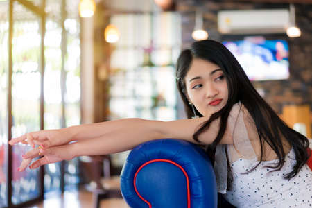 Portrait of woman smiling at vintage restaurant cafe.の写真素材