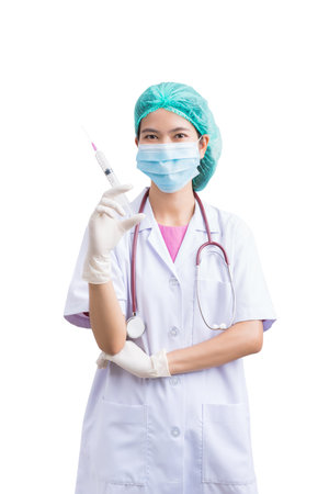 Portrait of Medical physician doctor or nurse uniform wearing surgical mask and vaccine dose flu shot drug syringe isolated on white background, mature female medical nurse or practitioner with stethoscope look at camera. Healthcare conceptの写真素材